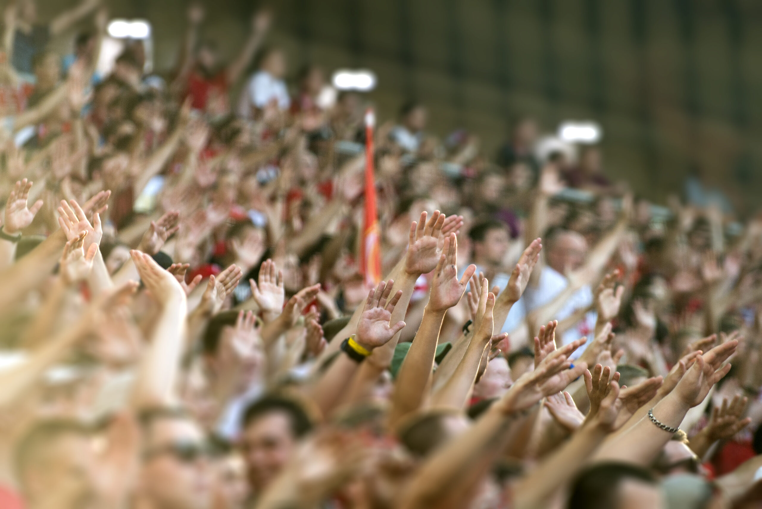 Football fans clapping on the podium of the stadium